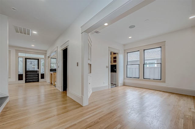 spare room with light wood-type flooring