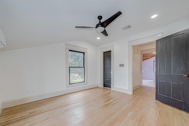 unfurnished bedroom featuring vaulted ceiling, ceiling fan, and light hardwood / wood-style floors