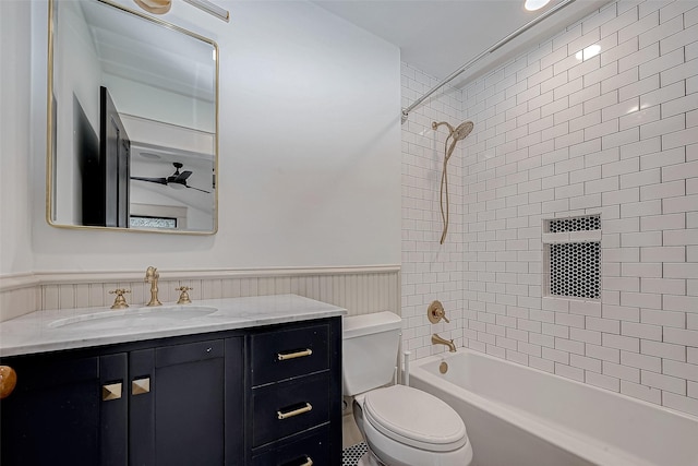 full bathroom featuring vanity, toilet, and tiled shower / bath combo