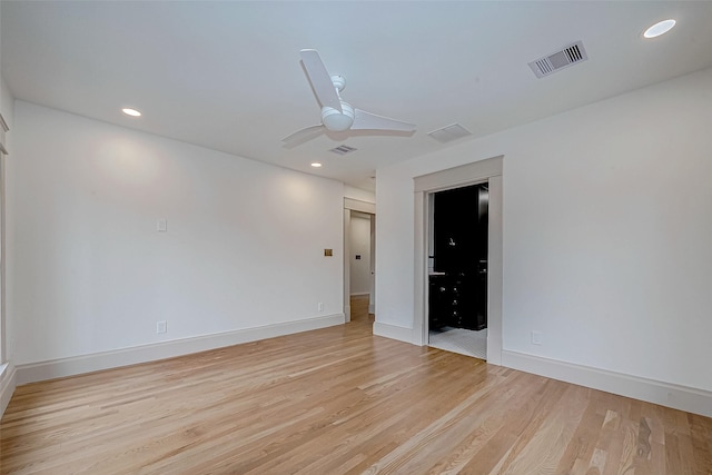 unfurnished room with ceiling fan and light wood-type flooring