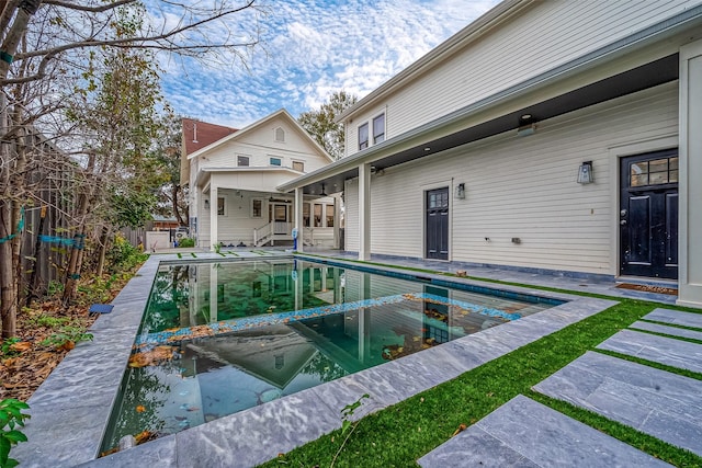 view of swimming pool featuring a patio area