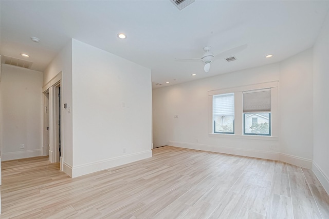 unfurnished room featuring ceiling fan and light wood-type flooring