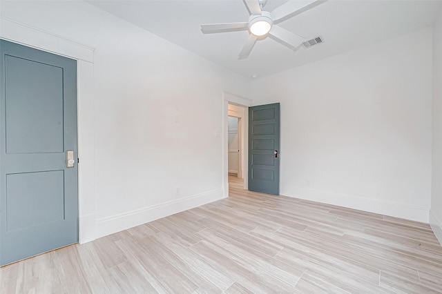 unfurnished room with ceiling fan and light hardwood / wood-style floors