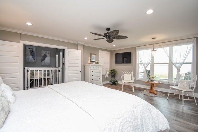 bedroom with crown molding, dark hardwood / wood-style floors, and ceiling fan