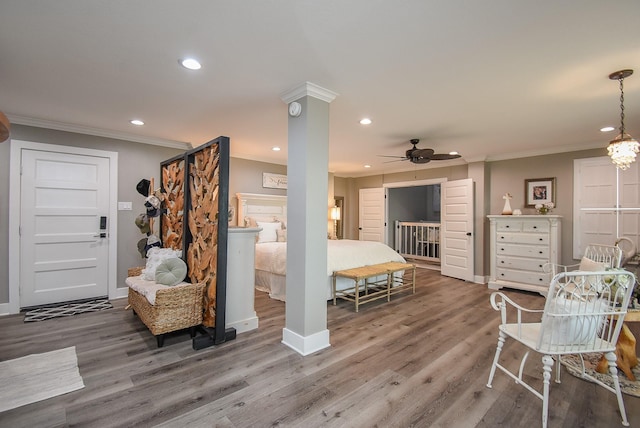 bedroom featuring crown molding, ceiling fan, and hardwood / wood-style floors