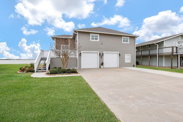 view of property with a garage and a front yard