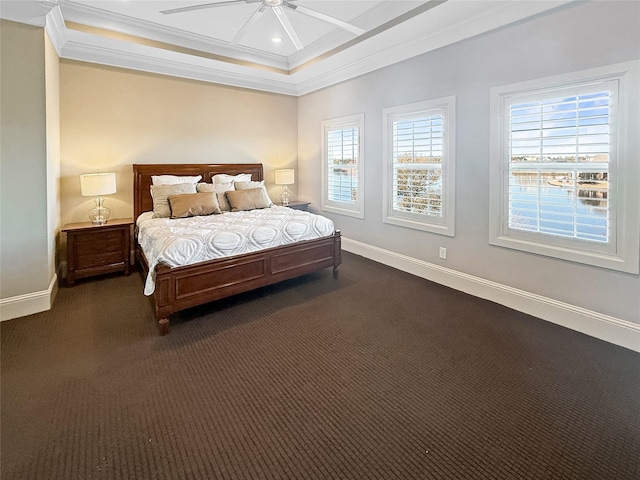 carpeted bedroom featuring ceiling fan and crown molding