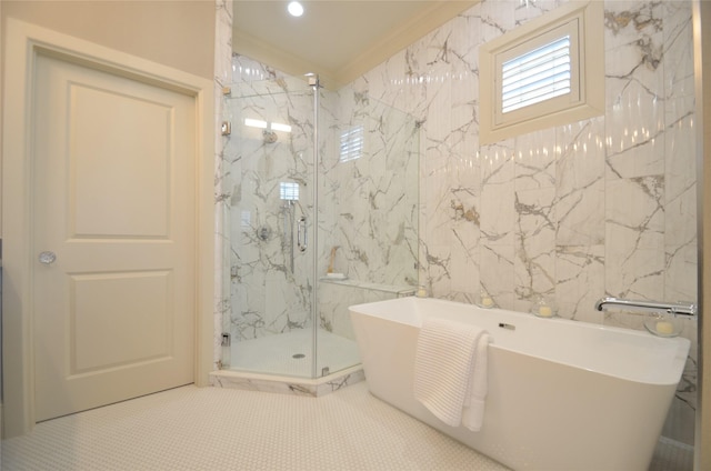 bathroom featuring tile patterned floors, tile walls, crown molding, and independent shower and bath