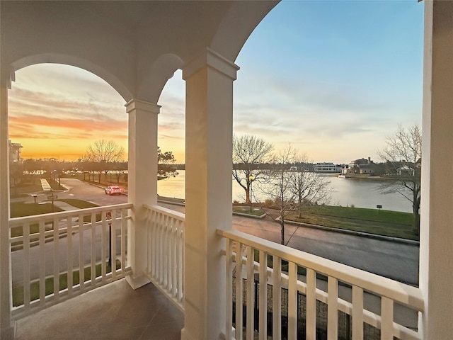 balcony at dusk with a water view