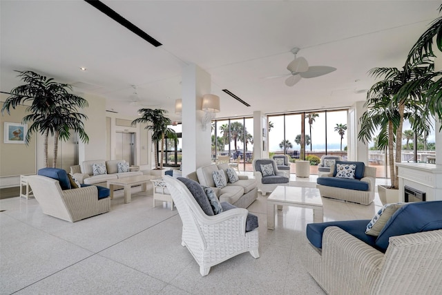 living room with light speckled floor and ceiling fan