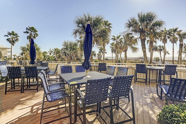 wooden terrace featuring outdoor dining area