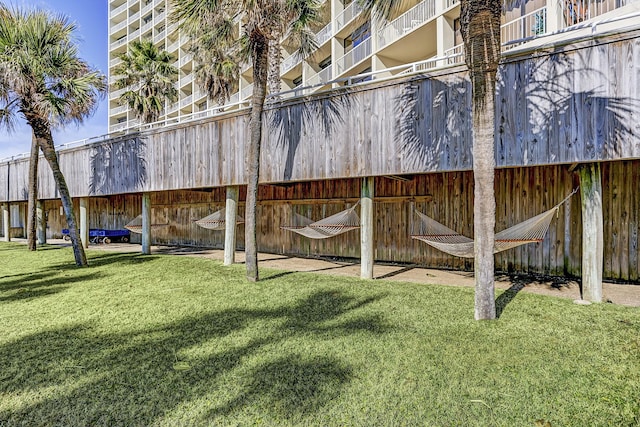 rear view of property with a lawn