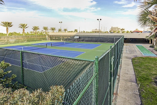 view of tennis court with fence