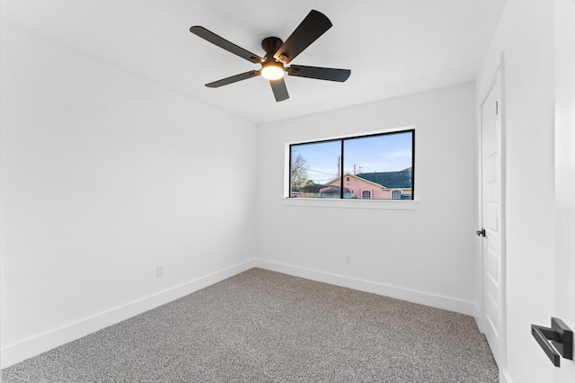 empty room featuring carpet floors and ceiling fan