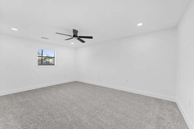 empty room with ceiling fan and carpet flooring