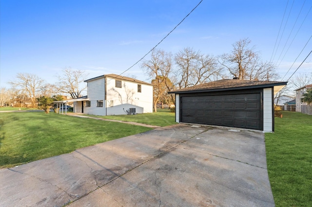 view of side of property with a garage, an outdoor structure, and a lawn