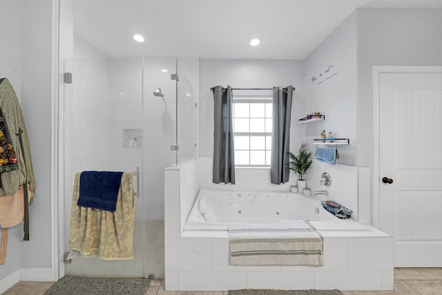 bathroom featuring separate shower and tub and tile patterned floors