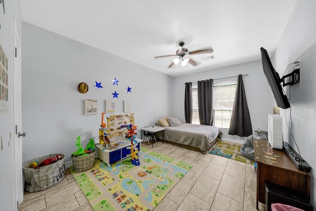 bedroom with light tile patterned floors and ceiling fan