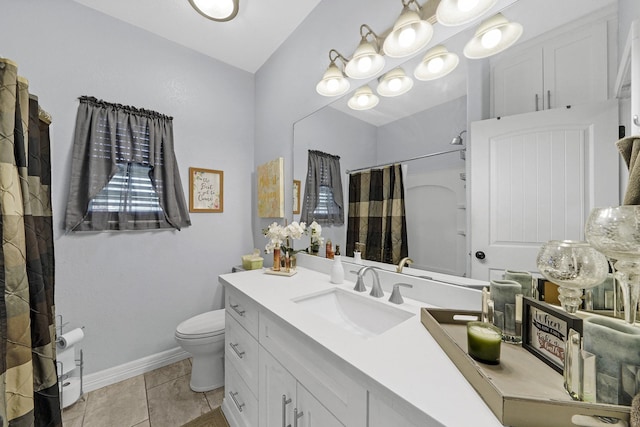 bathroom featuring vanity, walk in shower, tile patterned floors, and toilet