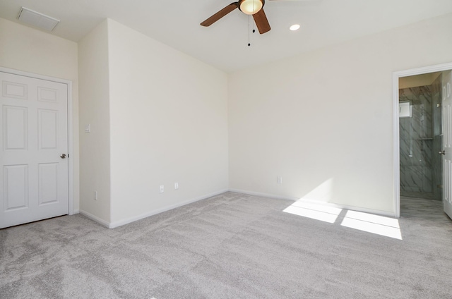 carpeted empty room with ceiling fan