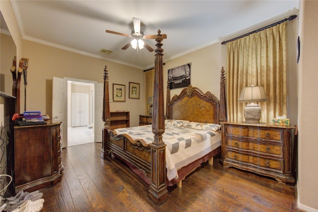 bedroom with dark hardwood / wood-style flooring, ornamental molding, and ceiling fan