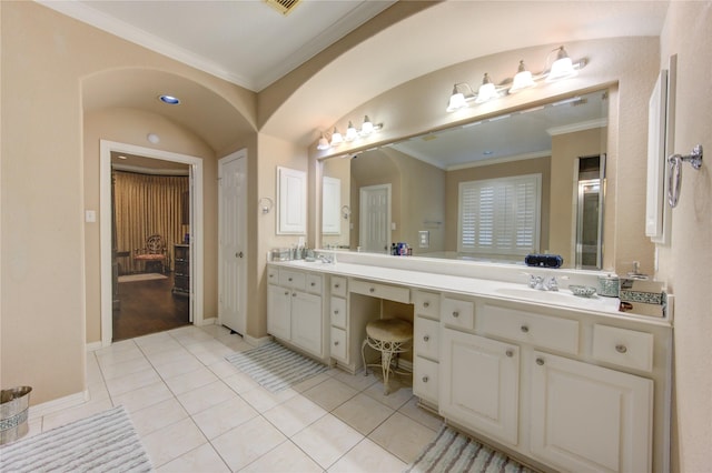 bathroom featuring crown molding, vanity, and tile patterned flooring