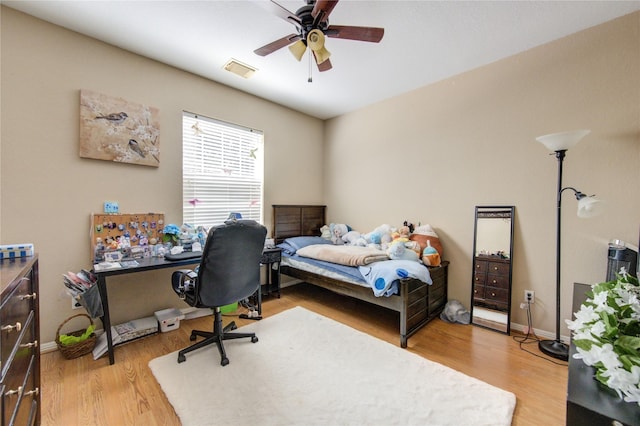 bedroom featuring ceiling fan and hardwood / wood-style floors