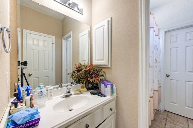 bathroom with vanity and tile patterned floors