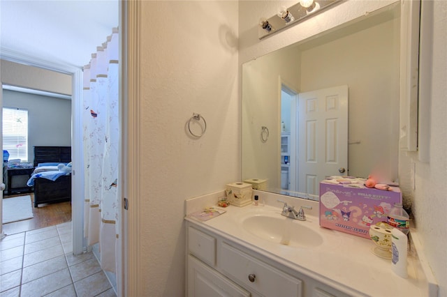 bathroom with tile patterned flooring and vanity