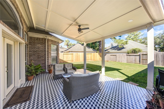 view of patio / terrace with ceiling fan and an outdoor living space