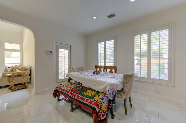 dining room with crown molding