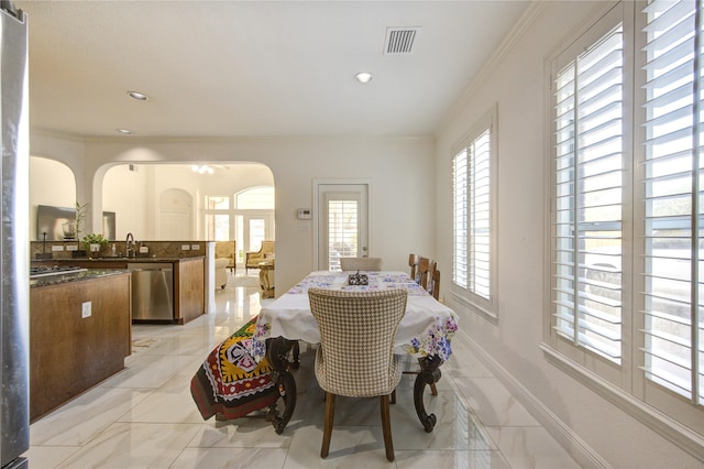 dining room with crown molding