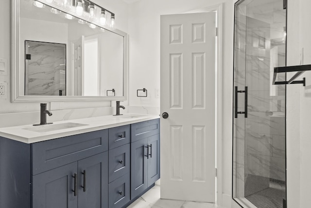 bathroom with a shower with door and vanity