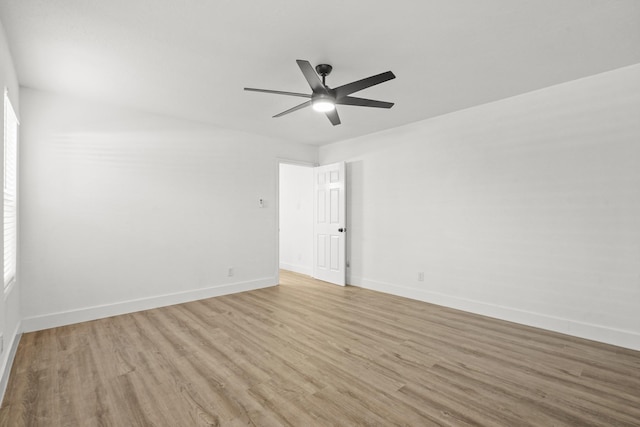 spare room featuring ceiling fan and light hardwood / wood-style floors