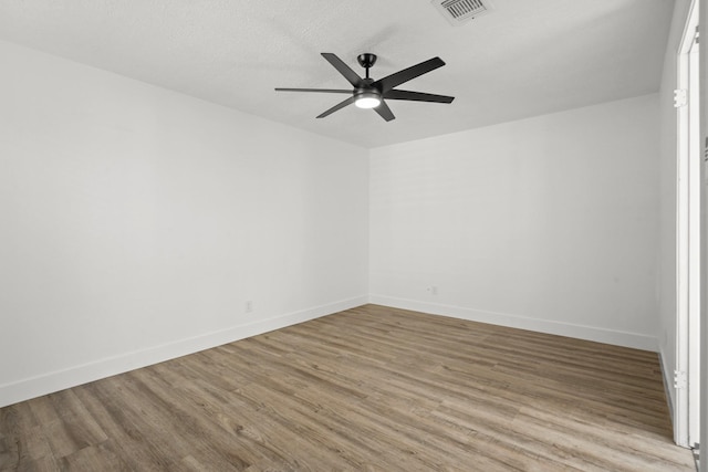 empty room with wood-type flooring and ceiling fan