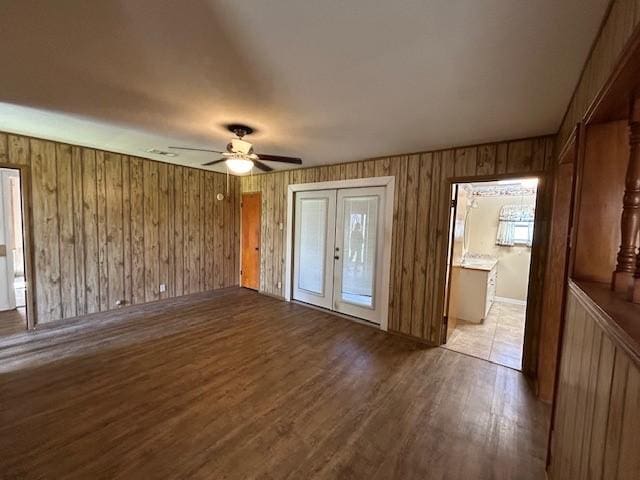 interior space featuring ceiling fan, light wood-type flooring, and french doors