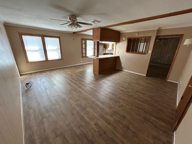 unfurnished living room featuring ceiling fan, ornamental molding, and dark hardwood / wood-style floors