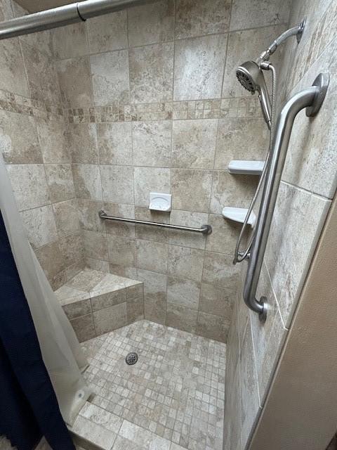 bathroom featuring a shower with curtain