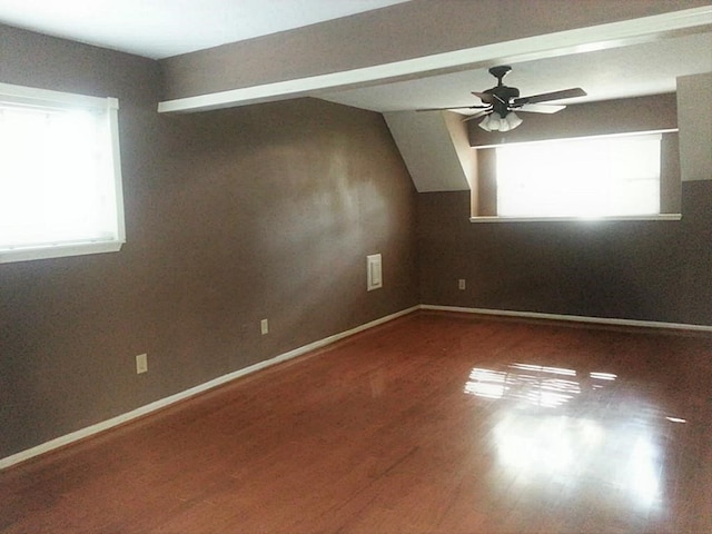 bonus room with wood-type flooring and ceiling fan