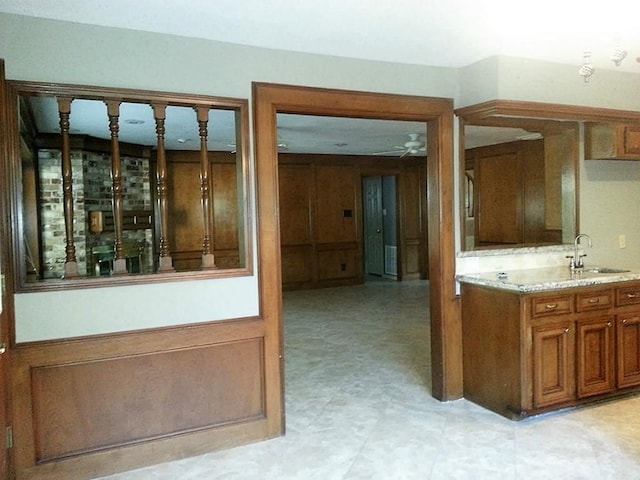 interior space featuring sink and ceiling fan