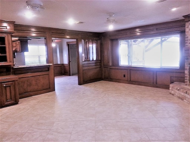 interior space with a wealth of natural light and wooden walls