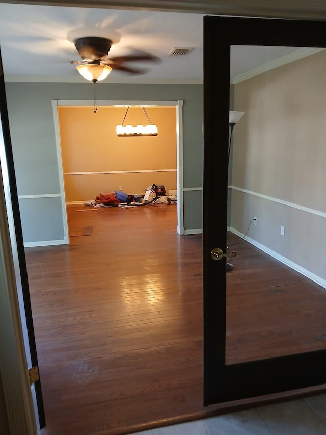 spare room featuring crown molding