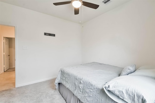 bedroom featuring light colored carpet and ceiling fan