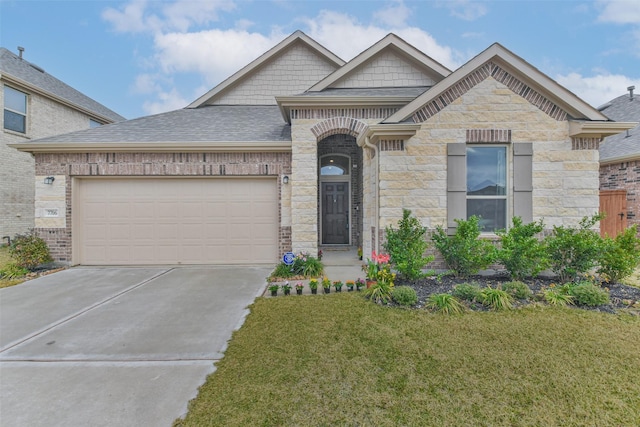 view of front of house with a garage and a front yard