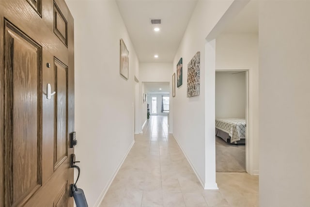 corridor with light tile patterned floors