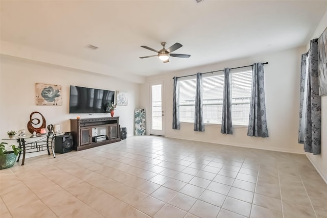 living room featuring light tile patterned floors and ceiling fan