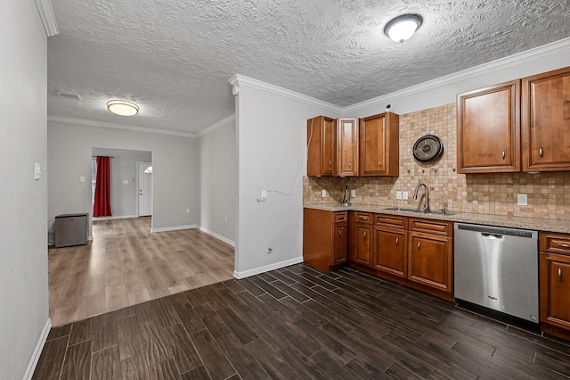 kitchen with sink, decorative backsplash, ornamental molding, and dishwasher