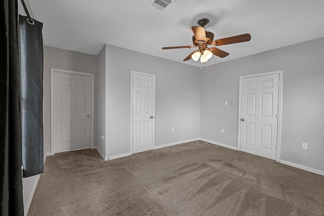 spare room with ceiling fan and carpet floors