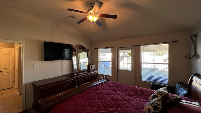 bedroom featuring ceiling fan, lofted ceiling, and light tile patterned floors