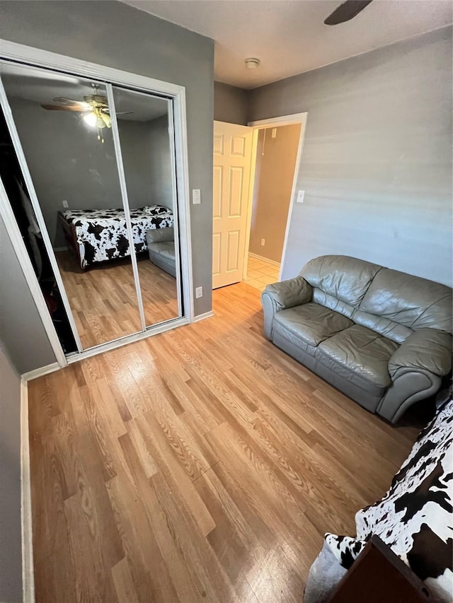 unfurnished living room featuring hardwood / wood-style flooring and ceiling fan